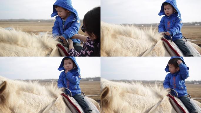 小孩子骑马