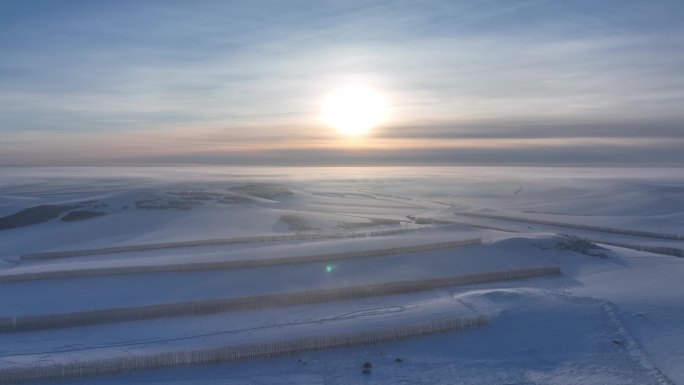 航拍高寒山地雪野日落