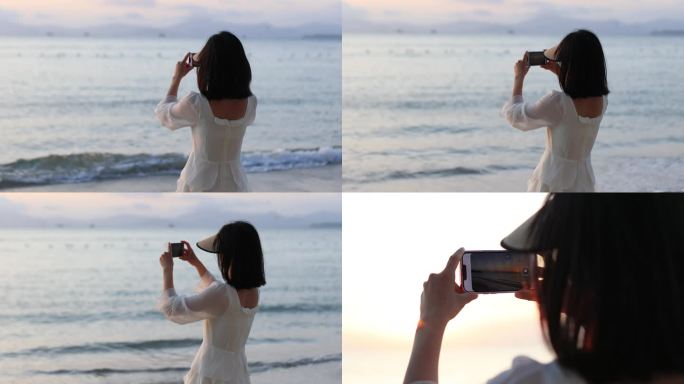 女生海边手机拍照