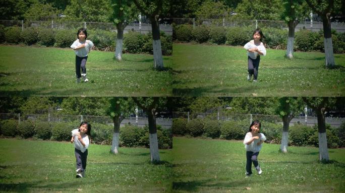 小女孩在草地上快乐奔跑
