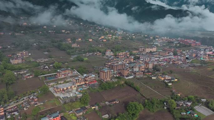 云南风光云层下山区民居怒江贡山县城