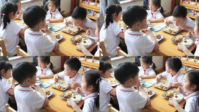 幼儿园孩子在教室认真的吃饭