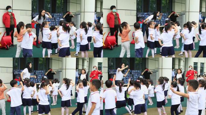 幼儿园老师教小朋友跳操