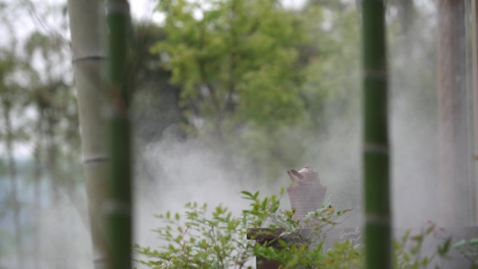 竹林中复古碳炉水壶围炉煮茶