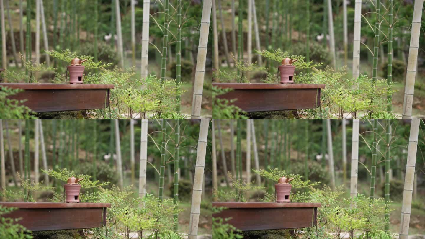 竹林中复古碳炉水壶围炉煮茶