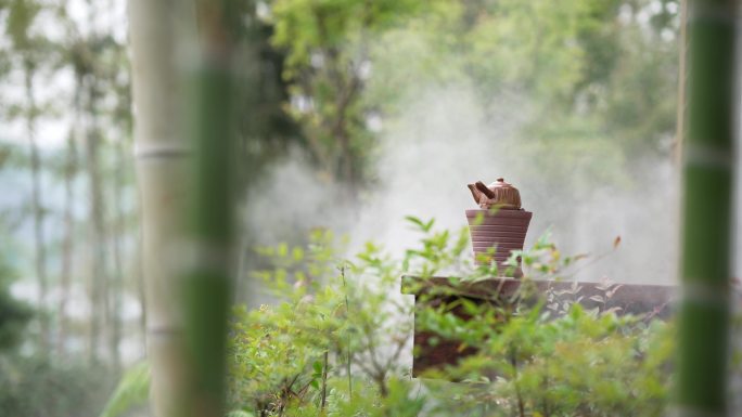 竹林中复古碳炉水壶围炉煮茶