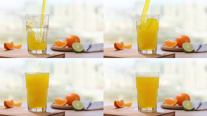 橙汁饮料倒入水杯