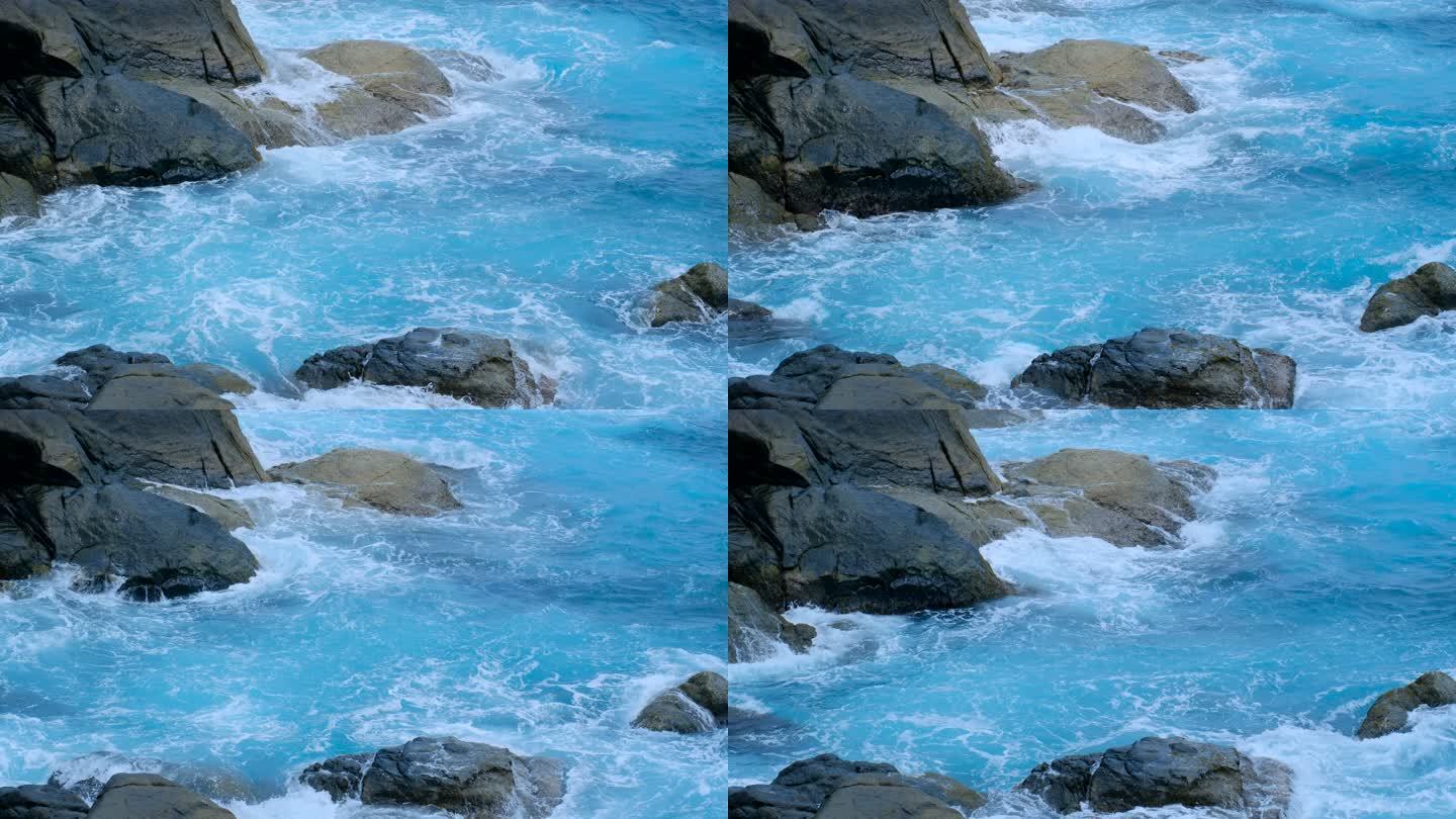 海南三亚大海边蓝色海浪拍打礁石岩石