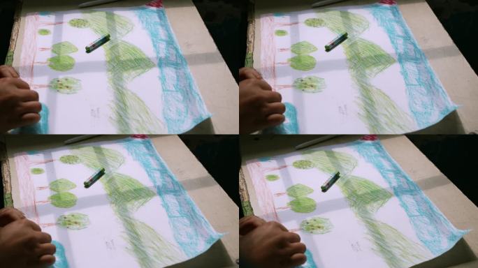 小学生在纸上画画 蓝天白云青山绿水