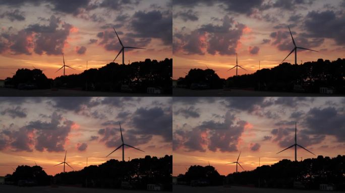夕阳晚霞风能风力发电环保风车电力经济发展