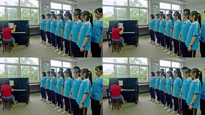 音乐老师弹奏钢琴辅导学生大合唱