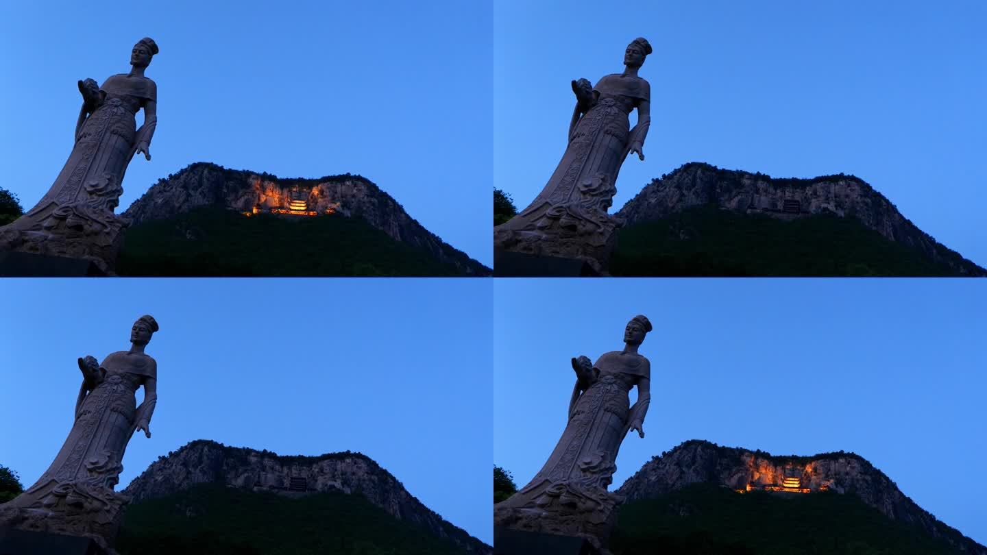 女娲雕像和山顶的女娲娘娘寺庙
