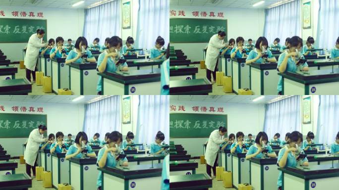 女老师在实验室辅导学生们操作显微镜