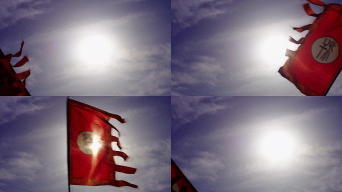太阳下挥舞着的古代战旗