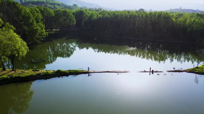 航拍在山林山间小湖钓鱼
