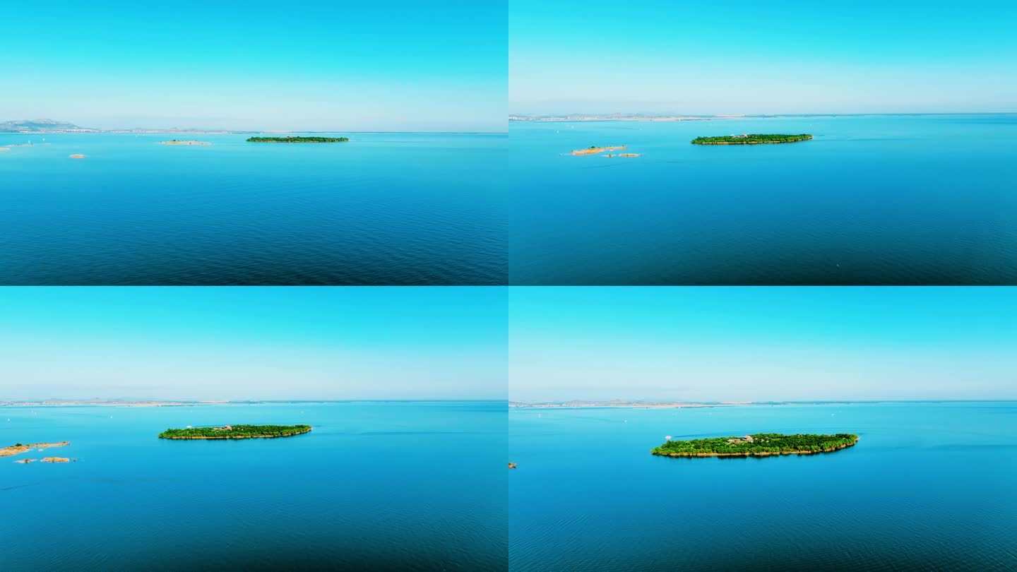 4K航拍蔚蓝的湖中一座翡翠般的小岛
