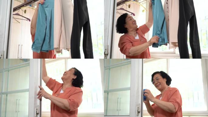 女人做家务擦玻璃晾衣服