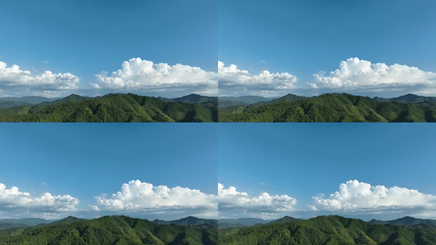 森林航拍山峰云朵山脉原始森林蓝天白云风景