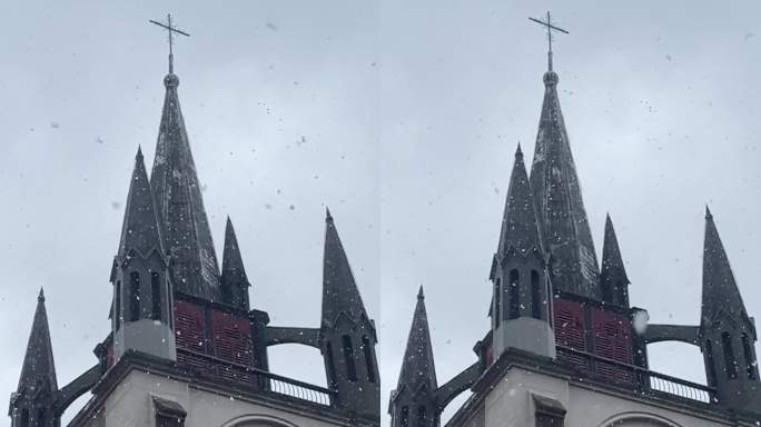 竖屏仰视城市教堂飘雪慢动作