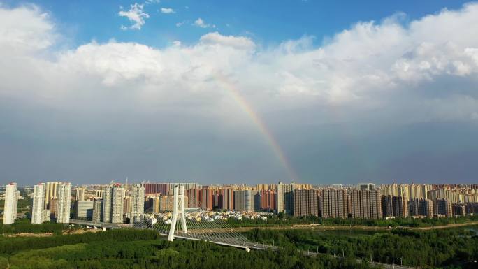 航拍雨后彩虹和潮白河上的燕潮大桥