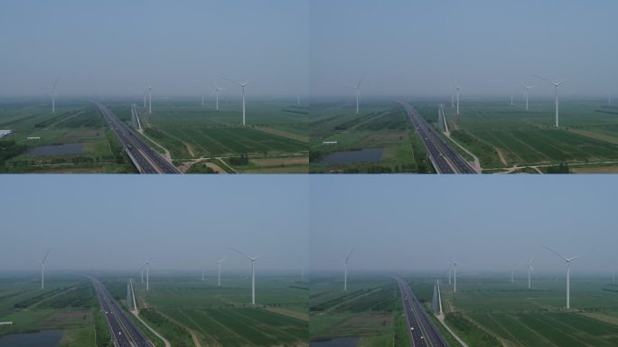 航拍高速公路旁的风力发电