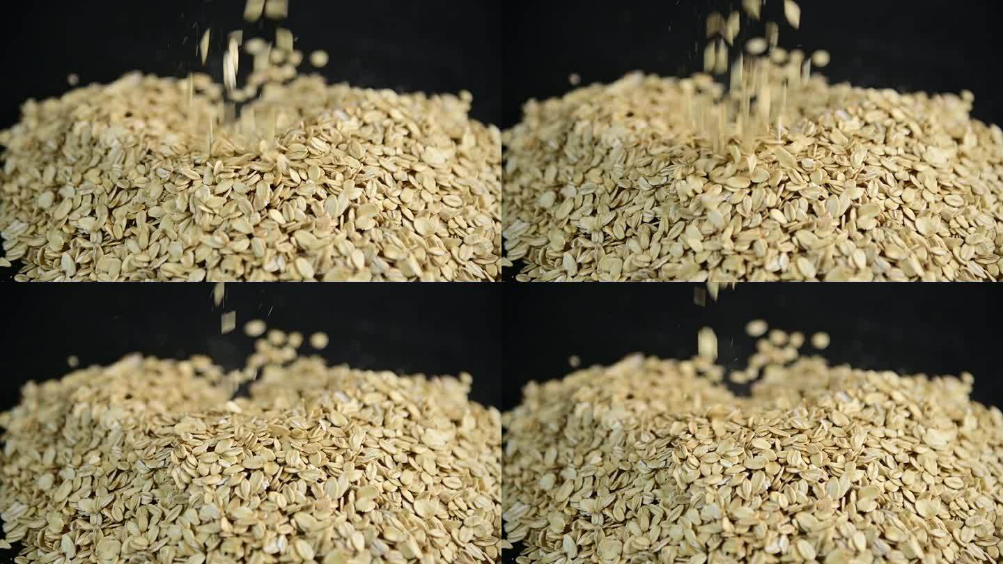 一把燕麦洒落在地上一堆燕麦