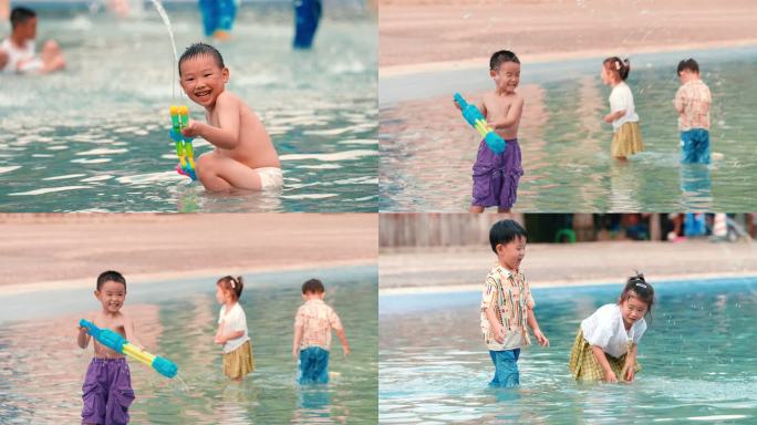 夏天小孩玩水踩水枪打闹戏水耍水