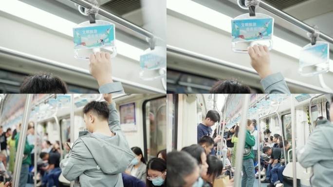 地铁上玩手机的人地铁乘客
