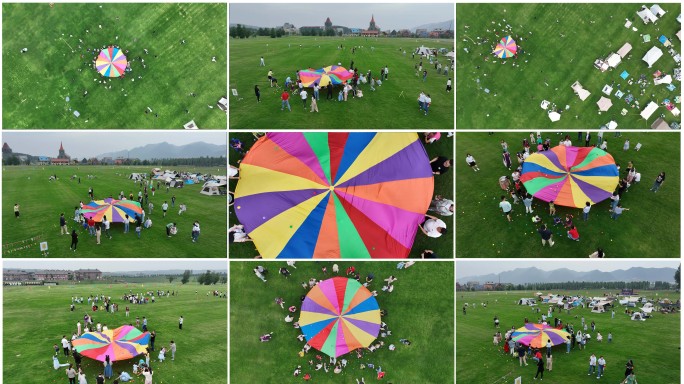 绿色草坪上大型户外团建亲子活动彩虹伞活动