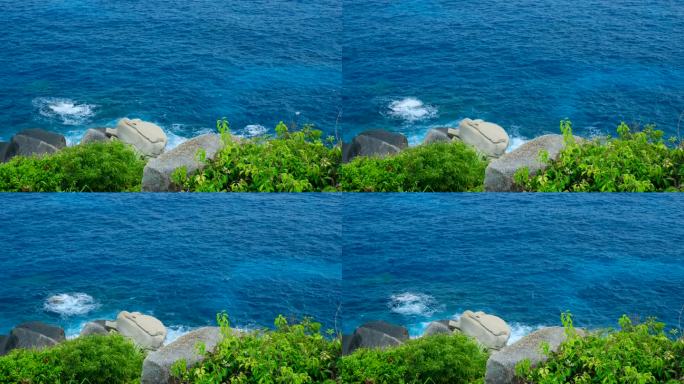 海南三亚大海边蓝色海浪拍打礁石岩石海景