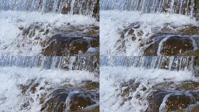 清澈的溪流水流和白色的水花慢镜头