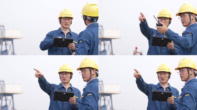 工程师在港口码头拿着平板电脑工作