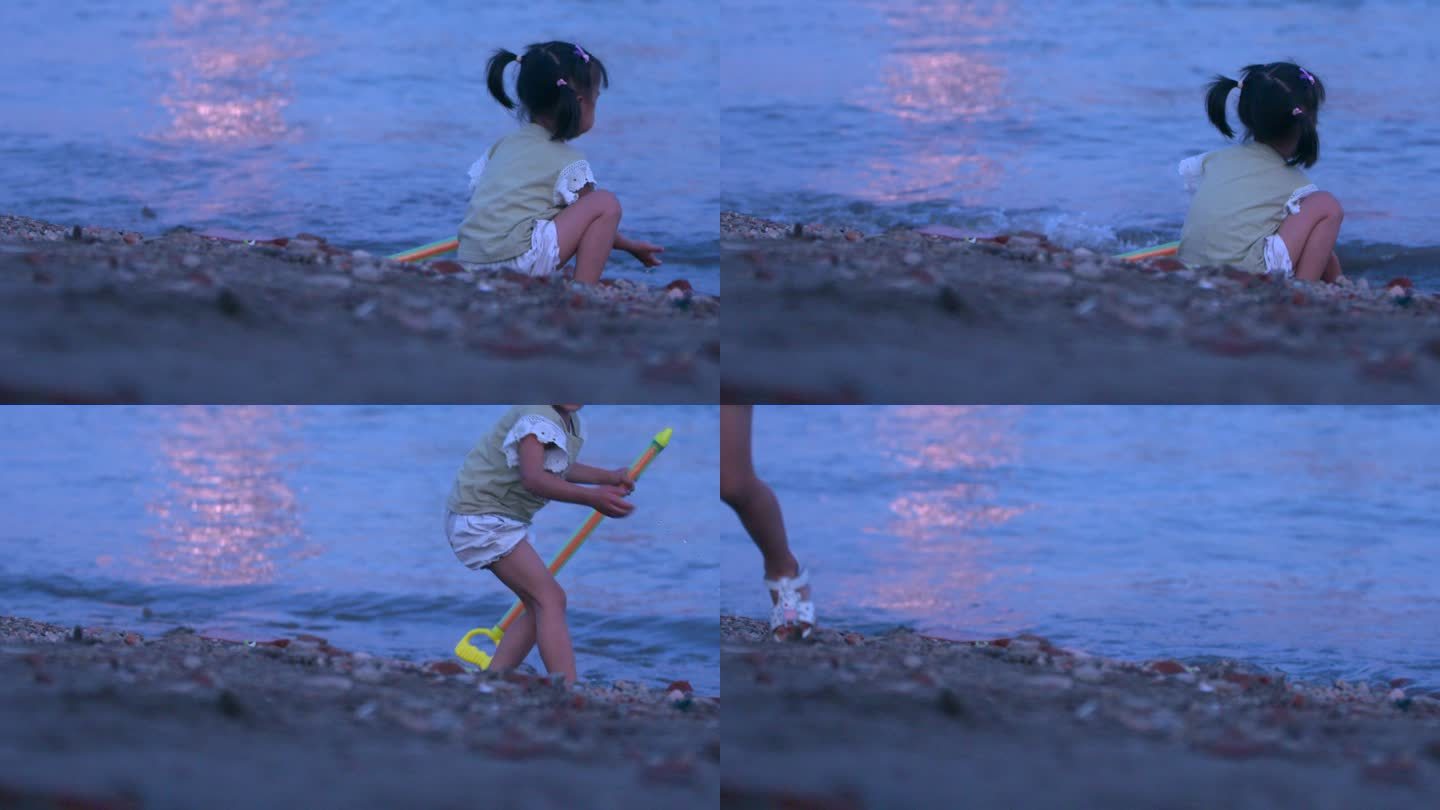 武汉武昌江滩傍晚夕阳余晖下玩水的小女孩