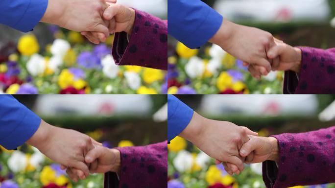 年轻人与老人亲切握手特写实拍原素材