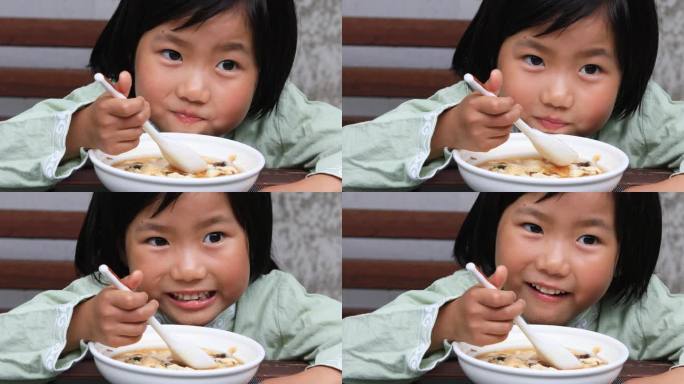 女孩在吃美味豆腐花