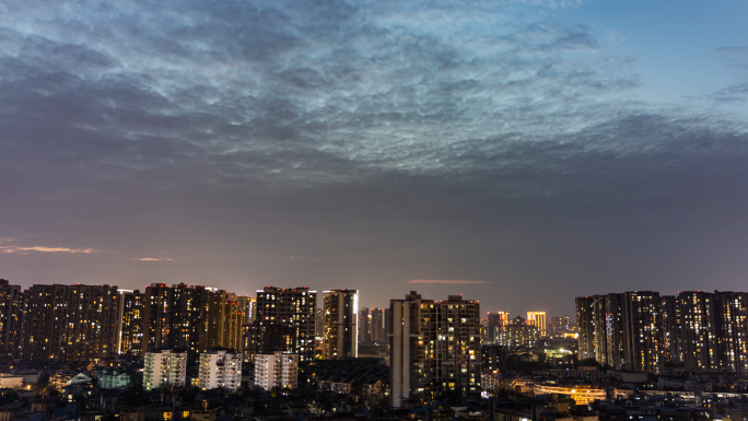 城市建筑亮灯延时天空晚霞日转夜白转黑延时