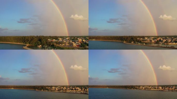 航拍海边小渔村的雨后彩虹