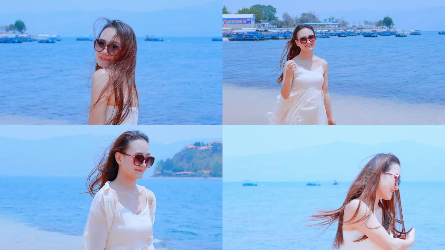 戴着墨镜穿着漂亮白裙在海边看海的美女