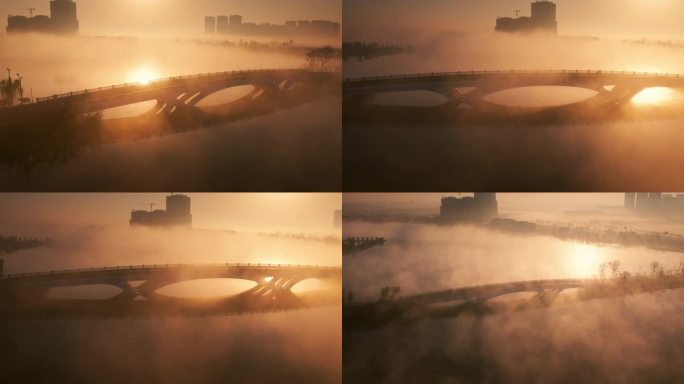 航拍日出晨雾中湖面上的桥梁与交通