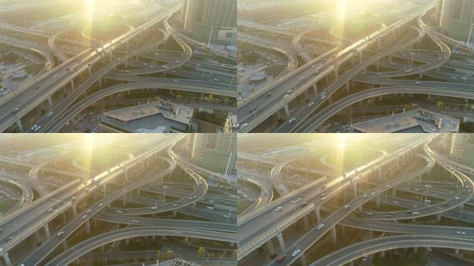 航拍郑州发达的交通系统_逆光拍摄高架桥