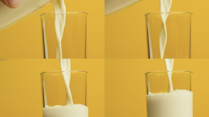 牛奶倒入杯子中高清特写