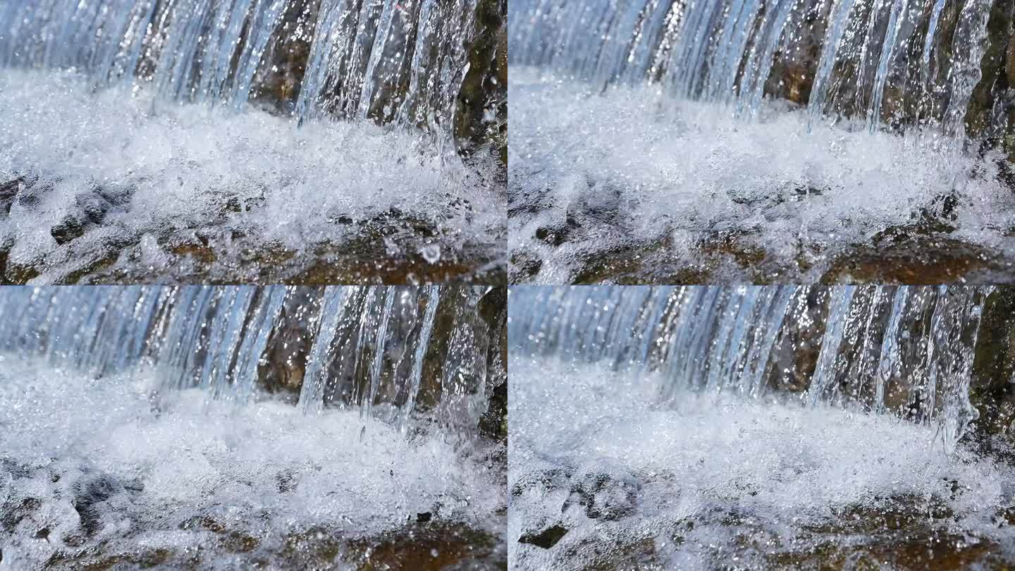 清澈的溪水水流和白色水花慢镜头
