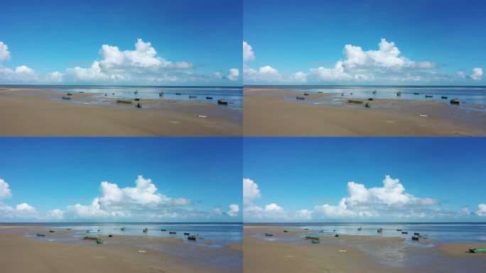 蓝天白云沙滩大海，一群飘动的渔船