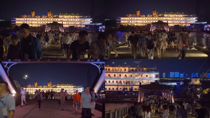 夜晚武汉知音号游轮码头上下游轮的旅客人流