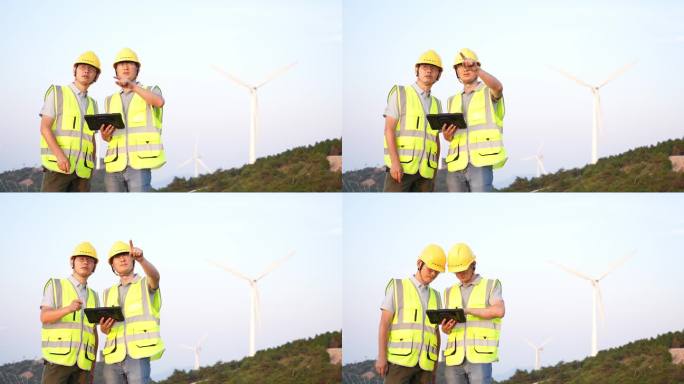 夕阳下工程师在风力发电风电场工作沟通