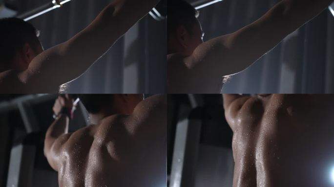 健身房的男人汗流浃背 肌肉上的汗珠 举重