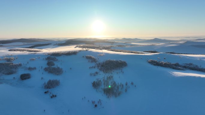 航拍冬日暖阳阳光丘陵雪原