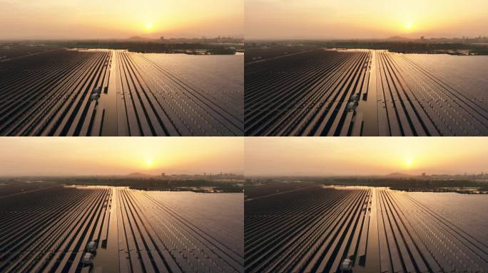 夕阳下的光伏太阳能发电站航拍