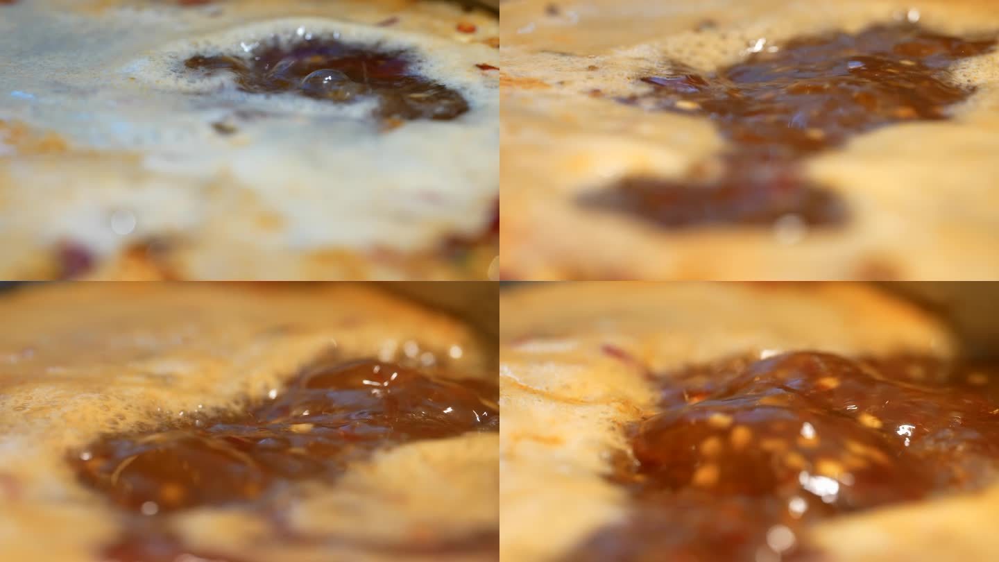 4K重庆火锅煮沸的红油汤底空镜