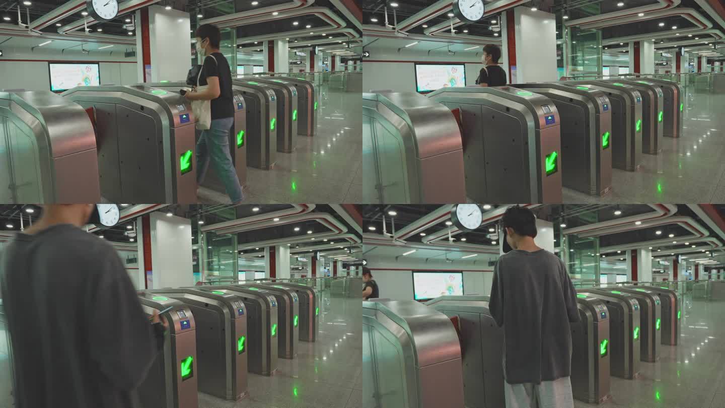 4K升格实拍广州市民走进地铁站检票闸口。
